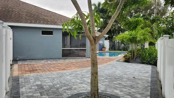 Evening patio with pavers and turf