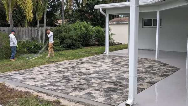 Evening patio with pavers and turf